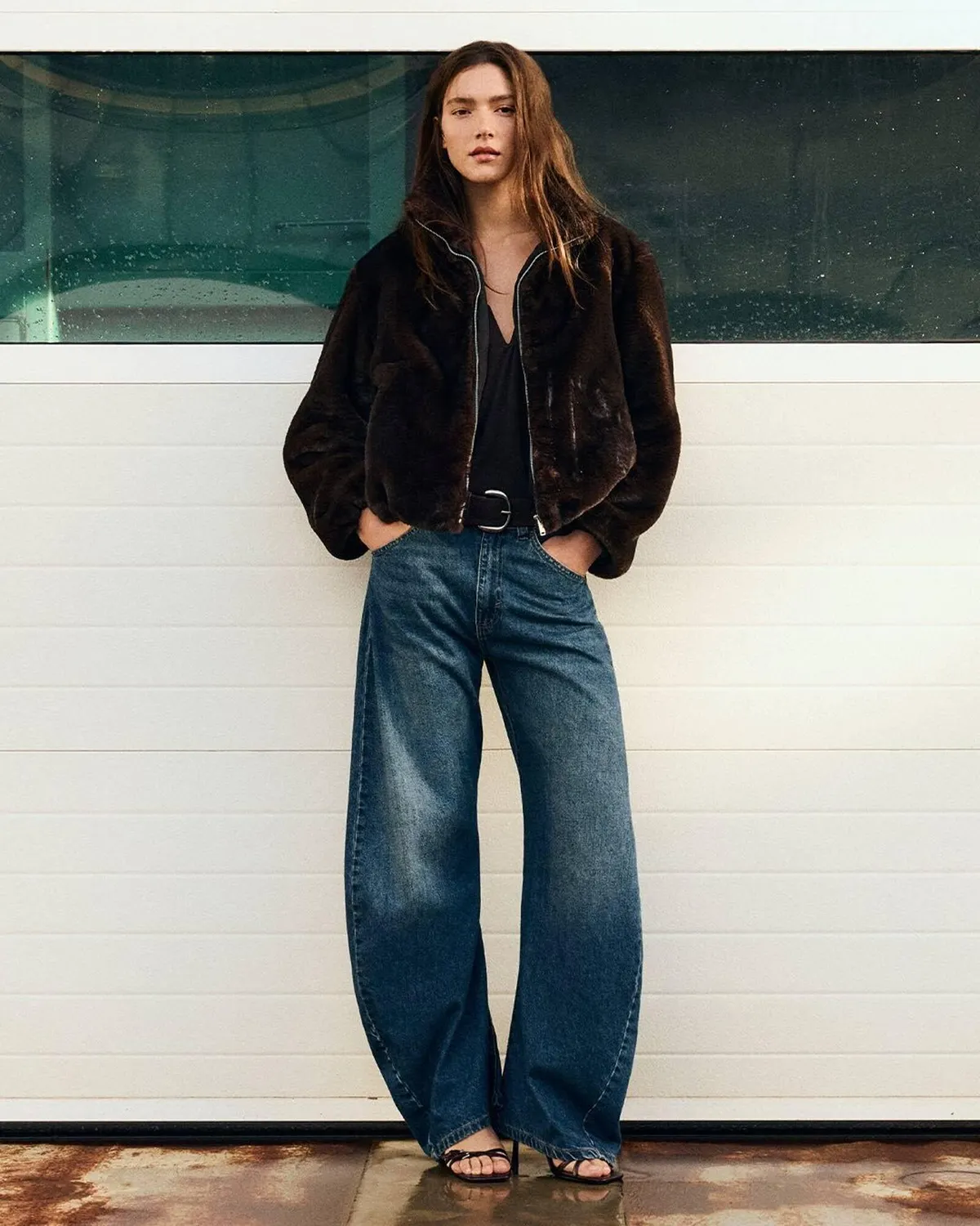 Woman in faux fur jacket with wide leg jeans
