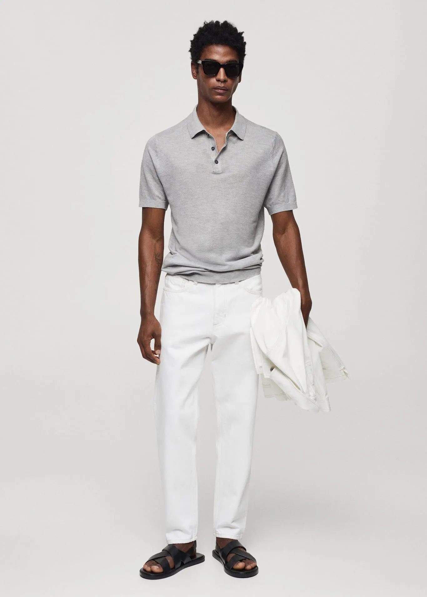 Buttoned micro-structure knitted polo shirt