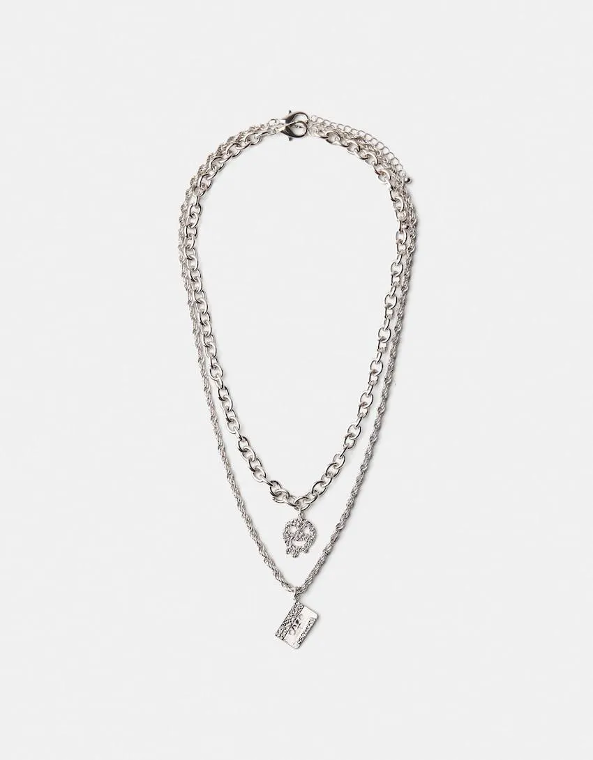 Set of 2 chokers with cassette charm