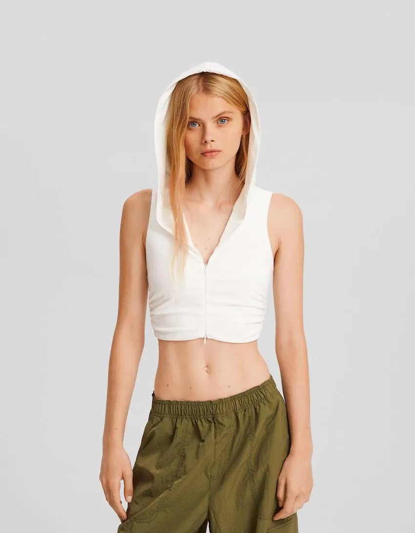 Sleeveless shirt with zip hood