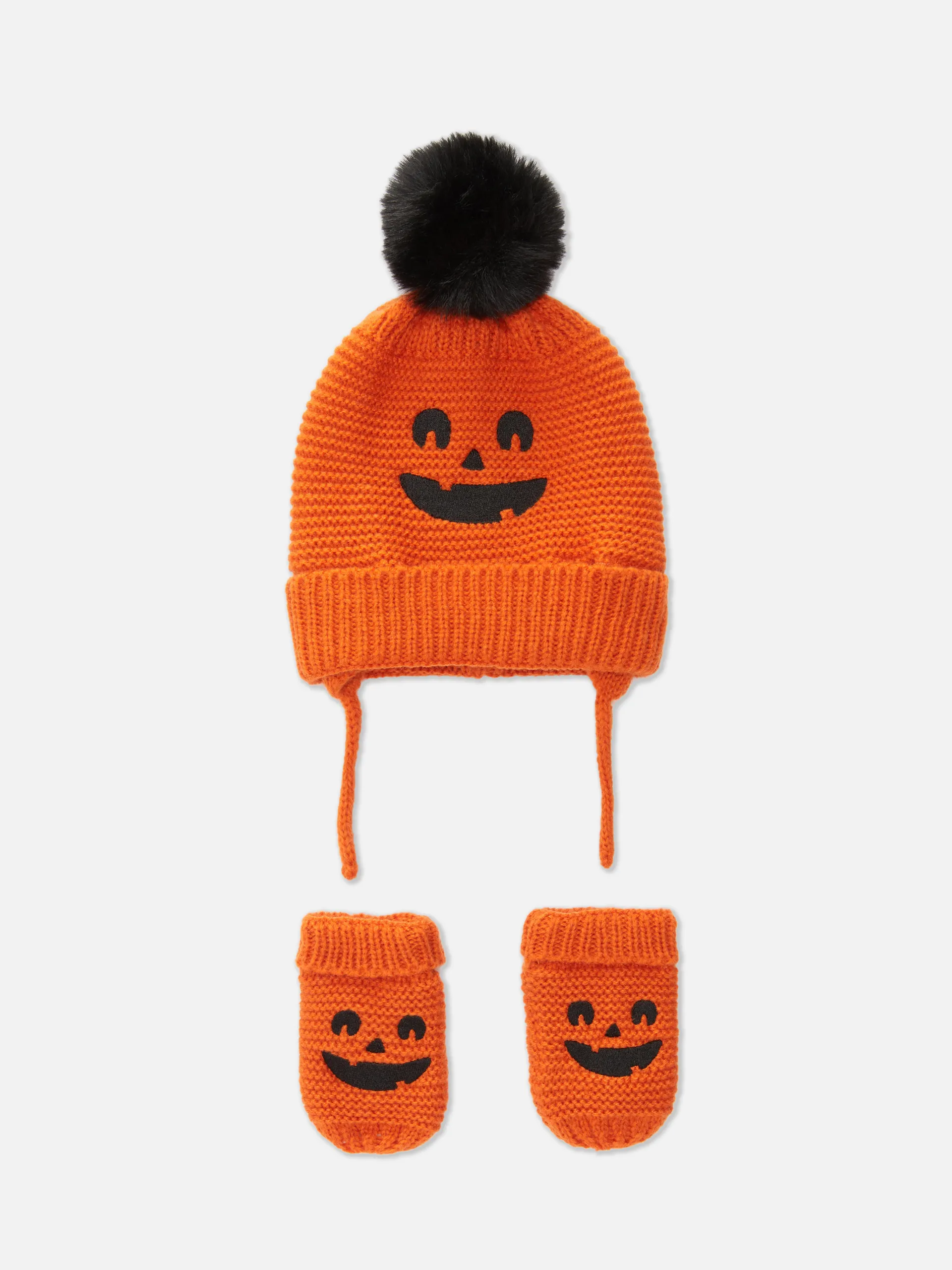 Gestrickte Beanie und Fäustlinge mit Kürbismotiv