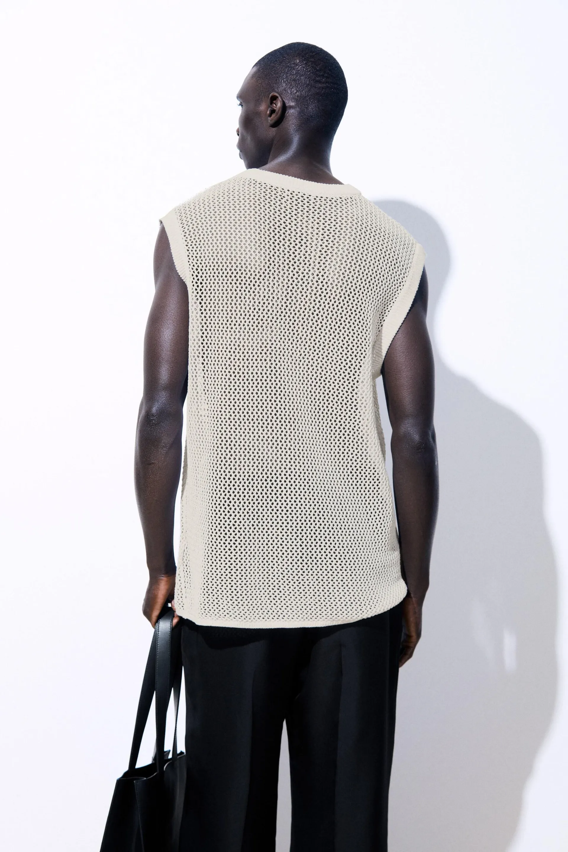 THE OVERSIZED FISHNET VEST