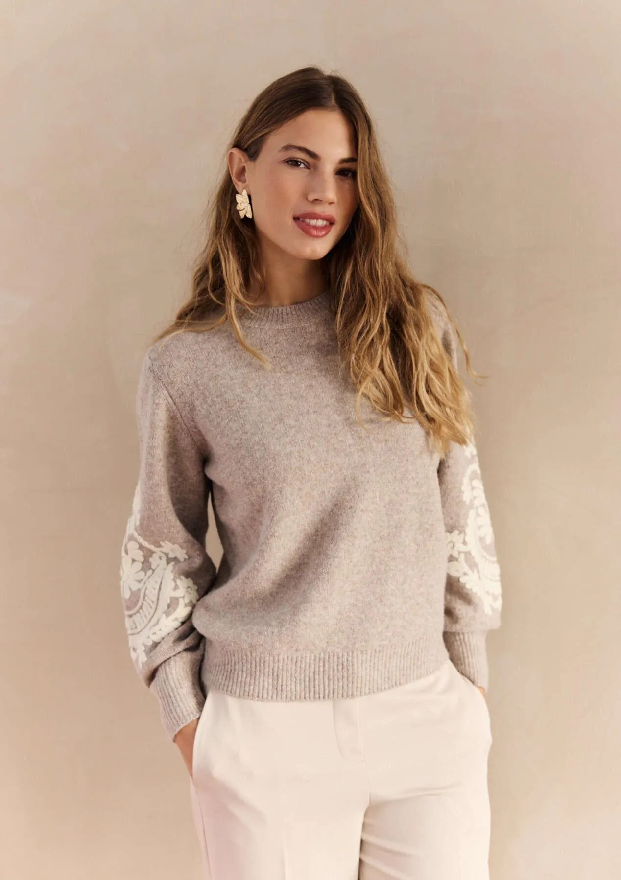 Embroidered sleeve statement knit