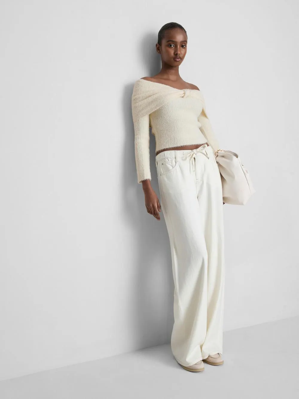 Pull à encolure bateau et finitions torsadées