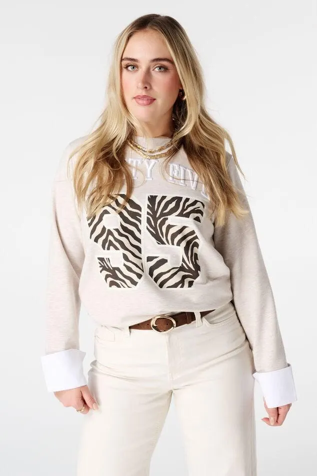 Sweater met blouse details