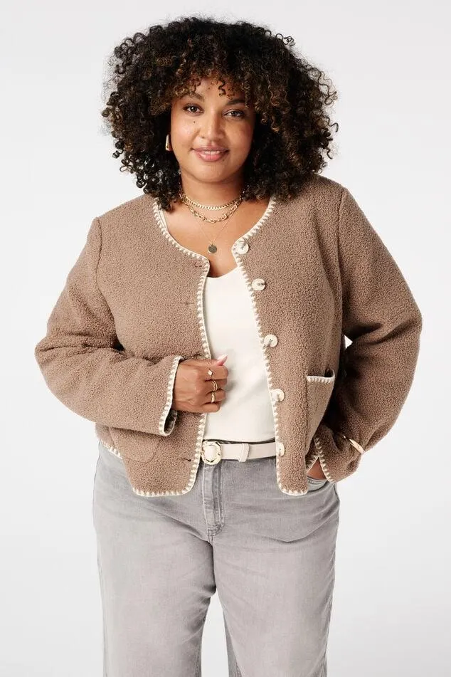 Teddy jasje met sierstiksels en knoopsluiting