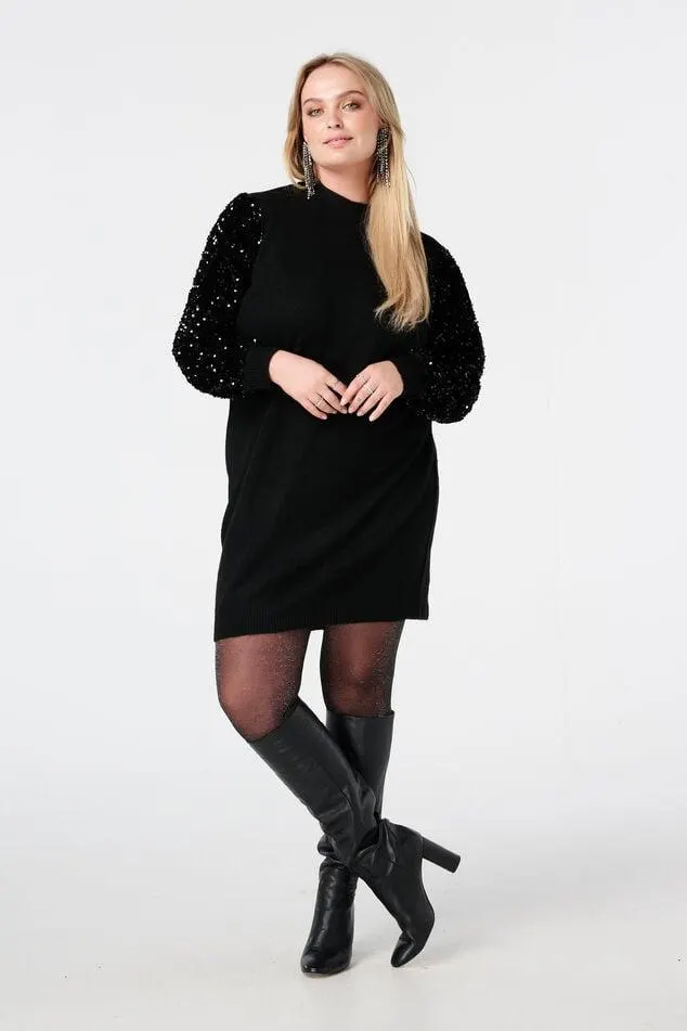 Gebreide tuniek met paillettenmouwen