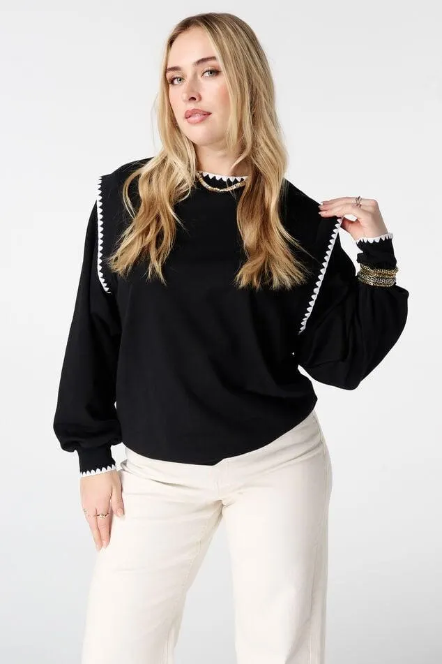 Trui met contrastboorden