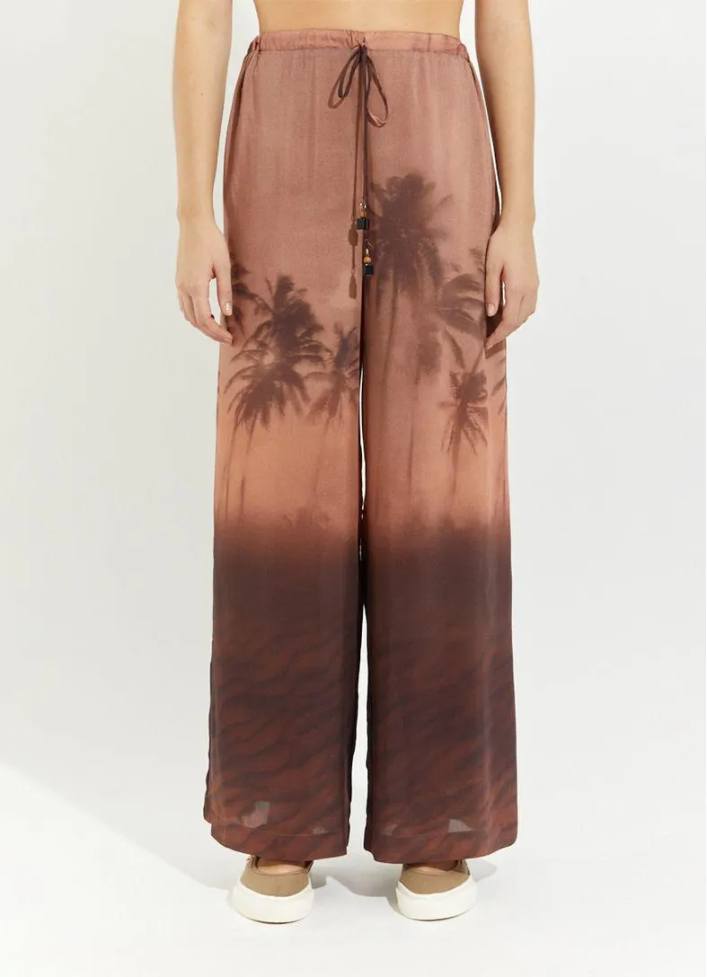 Calça estampada paisagem colab camila coutinho