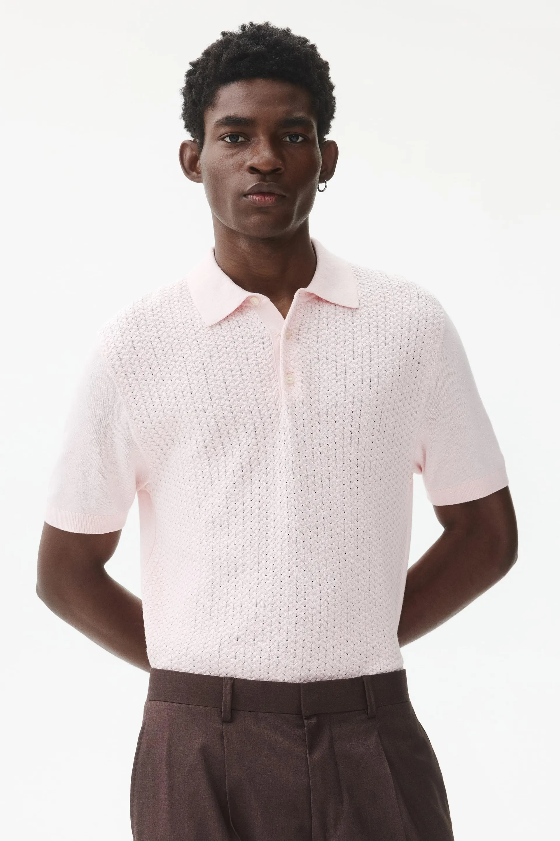 Polo ajusté en tricot torsadé