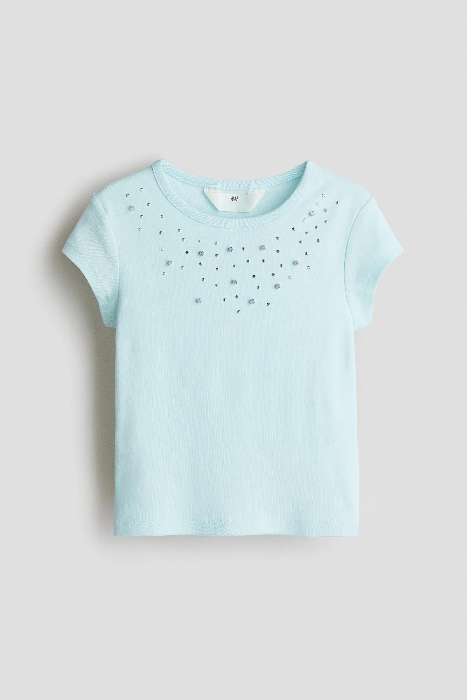 Top de algodón con detalles decorativos