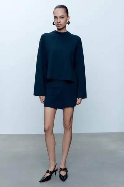 FALDA MINI PUNTO BOLSILLOS