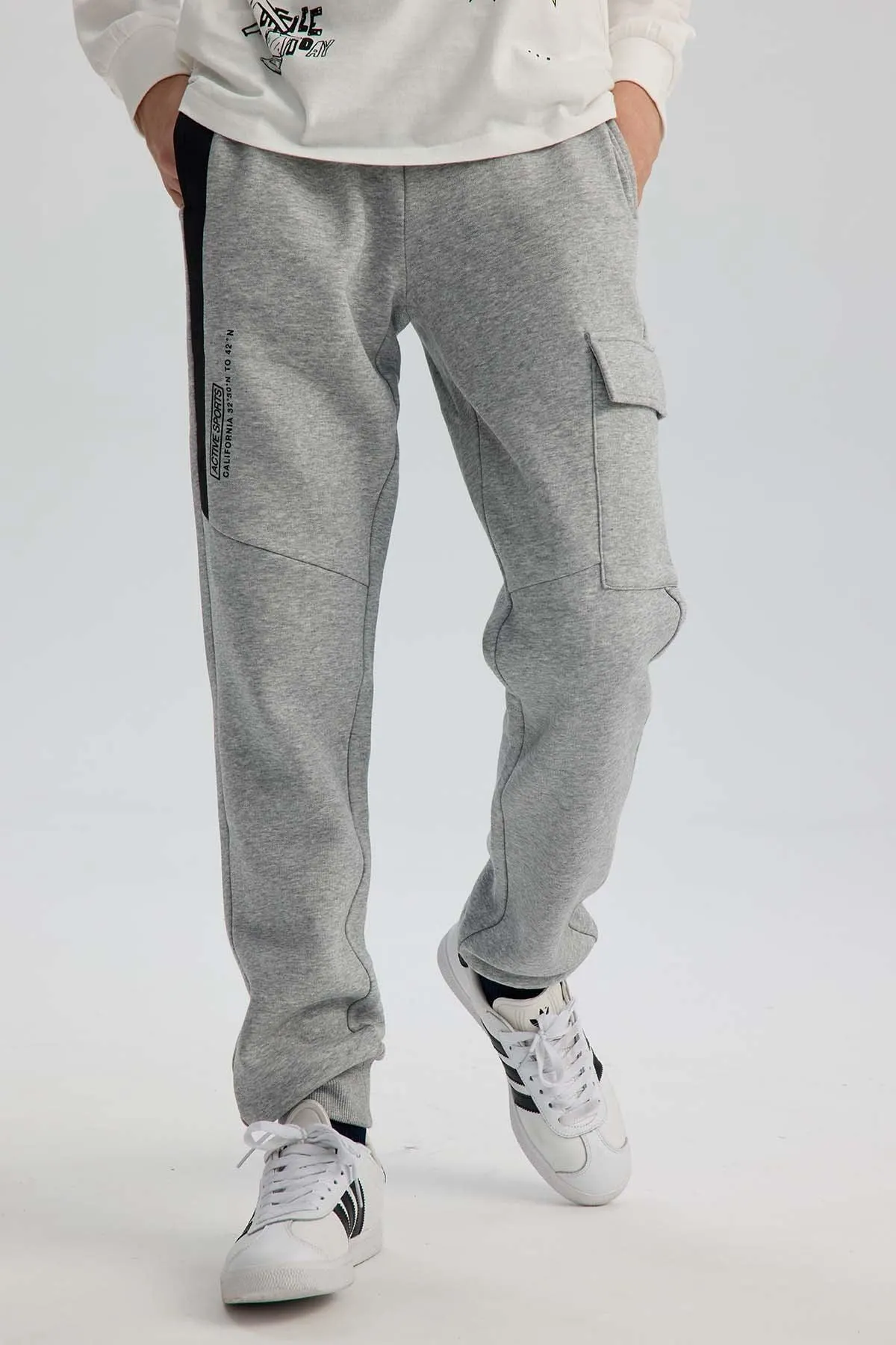 Pantalón Buzo Niño Cortes Bolsillo Gris Melange