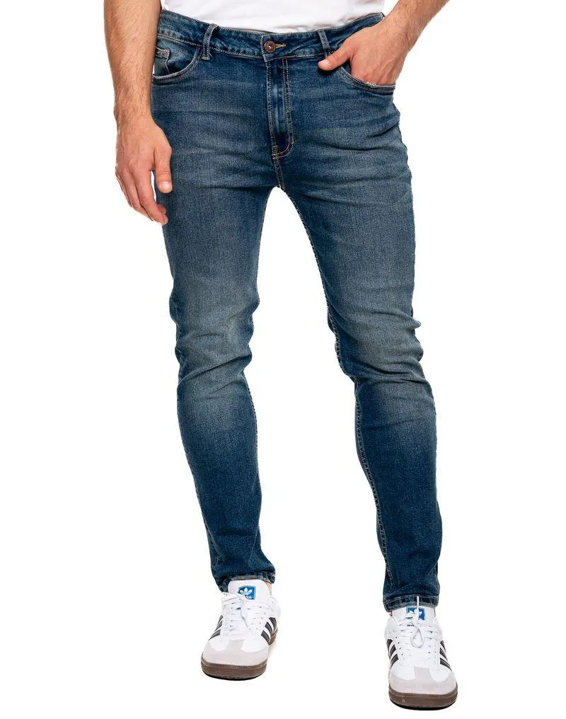 Skinny Fit Jeans Tono Medio Con Desgastes
