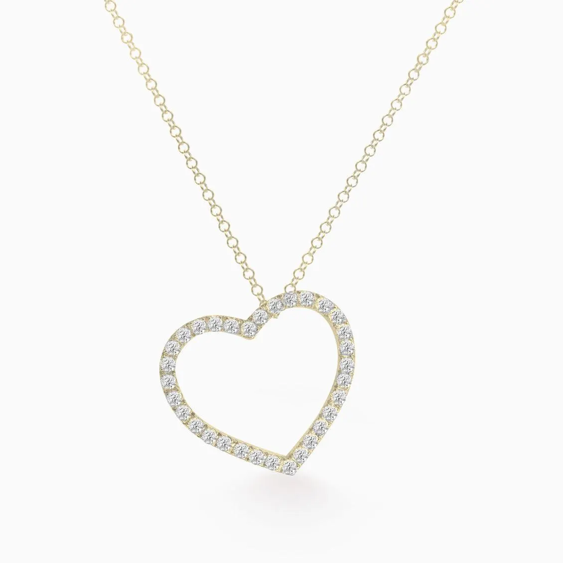 Dije en oro amarillo de 18K en forma de corazón con brillantes