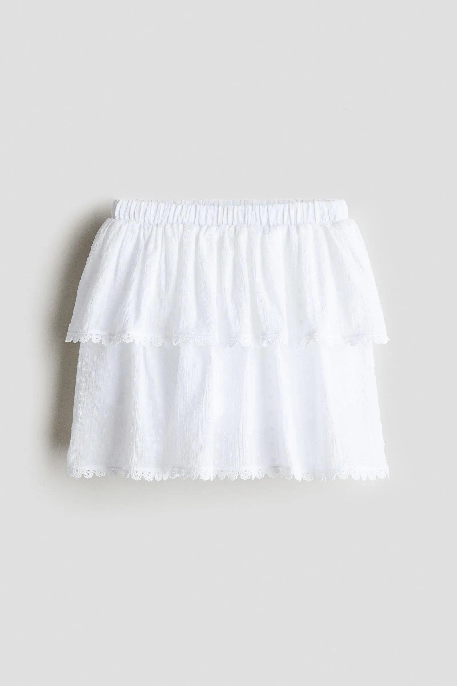 Falda short en algodón con diseño de volantes