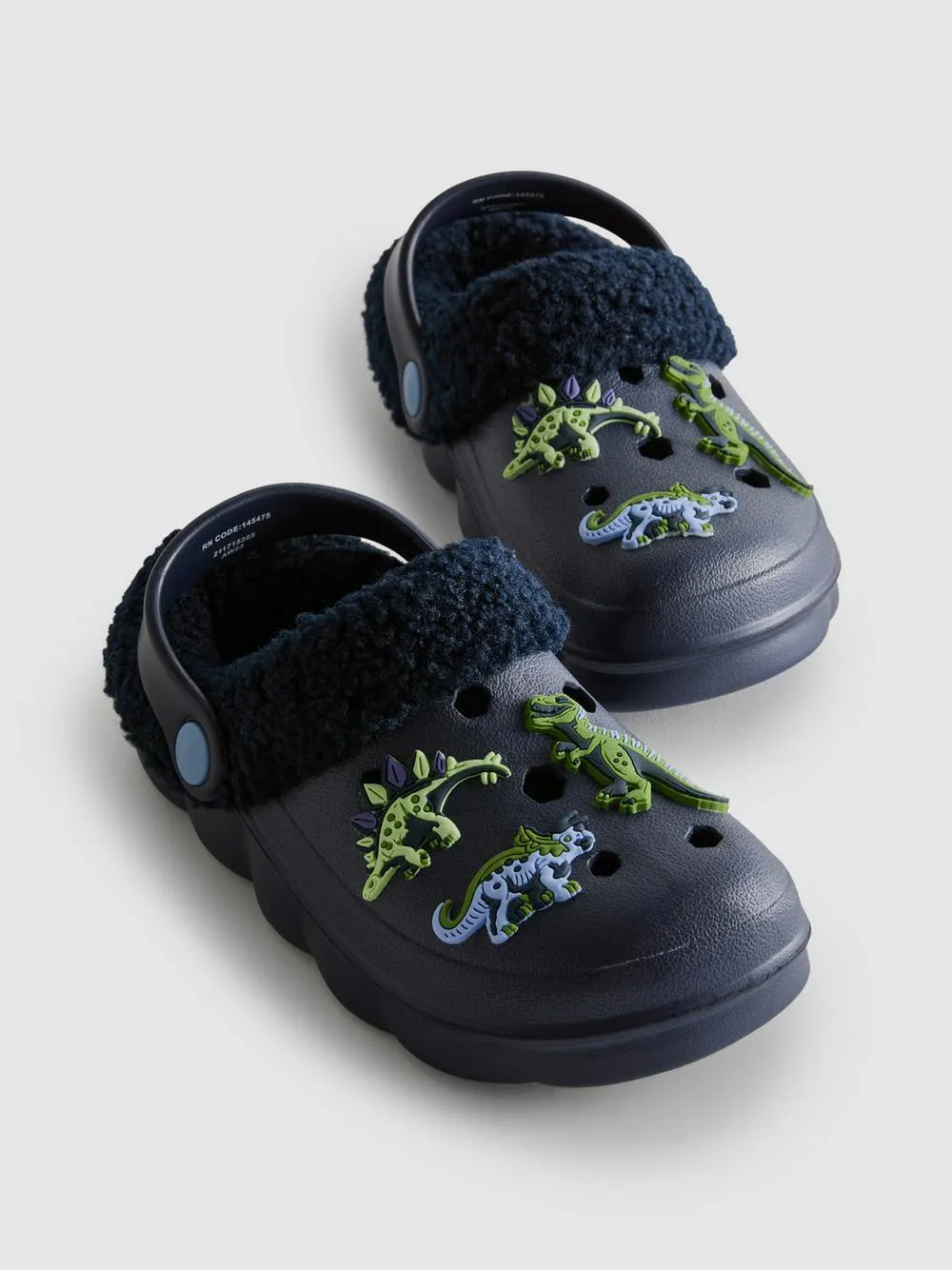 Pantofle s dinosaury lemované umělou kožešinou