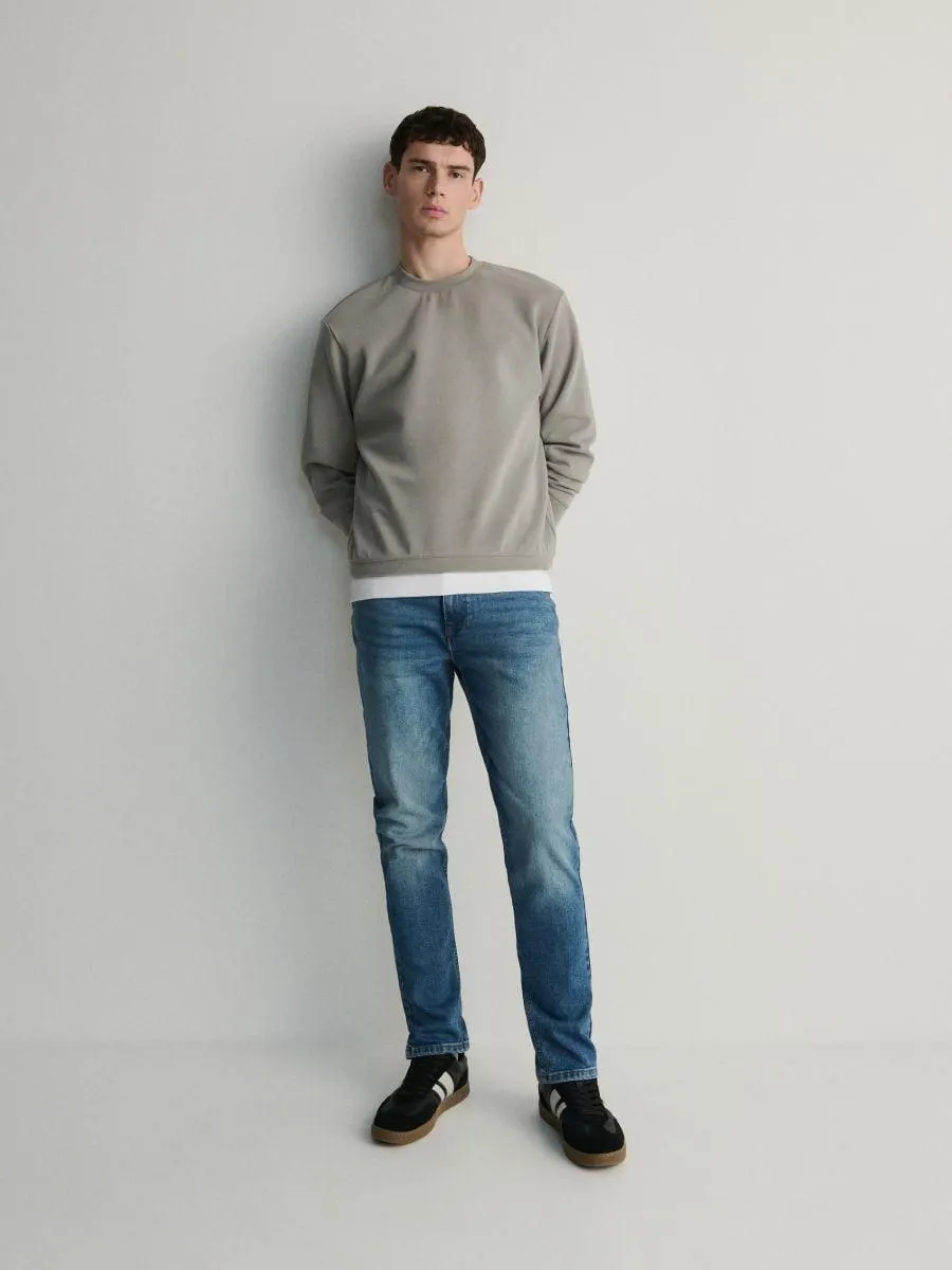 Džíny slim se sepraným efektem