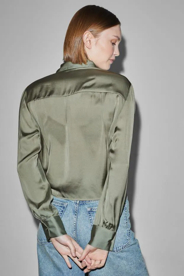 CLOCKHOUSE - satijnen blouse met knoop in de stof