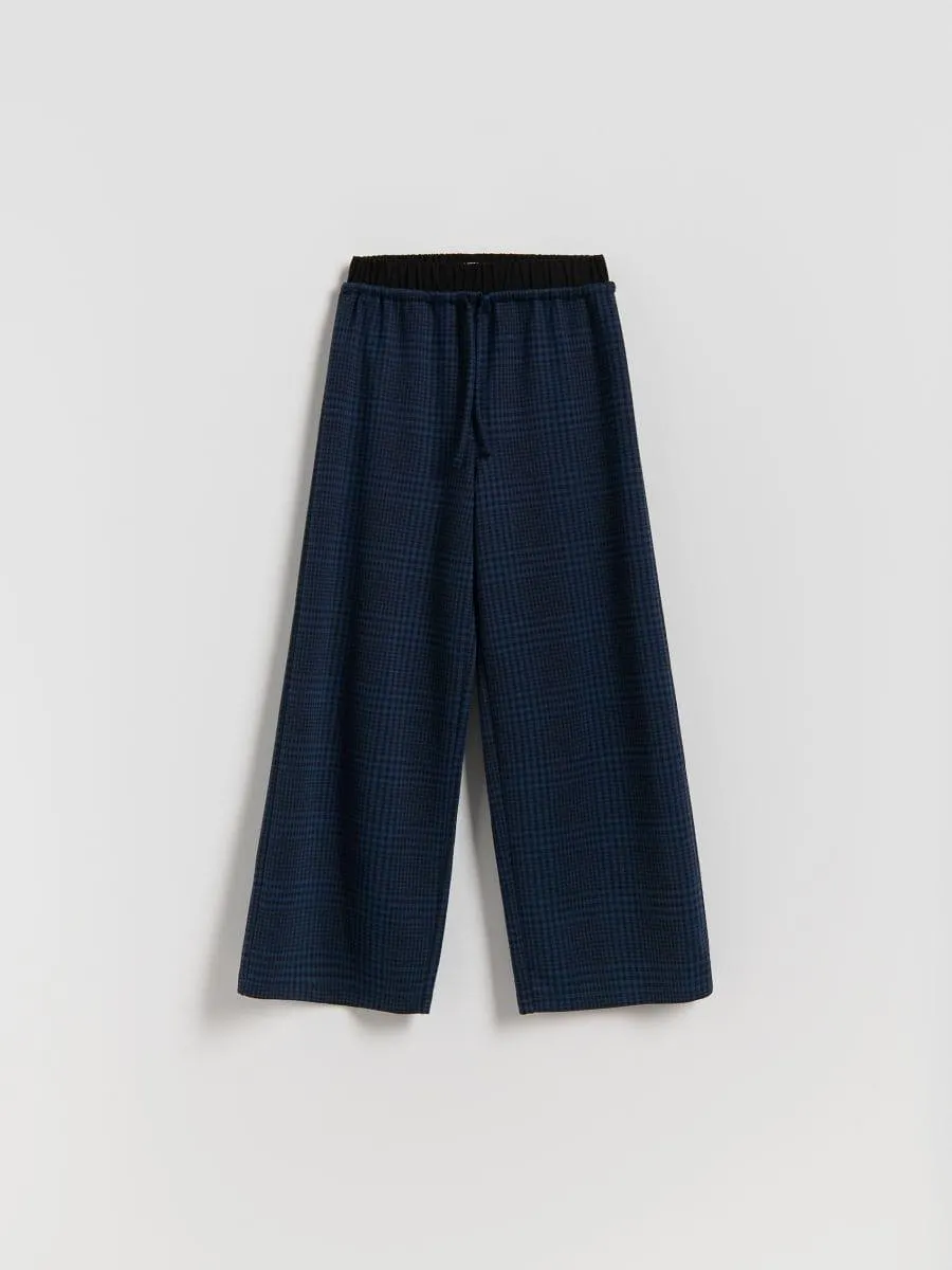 Volné kostkované kalhoty