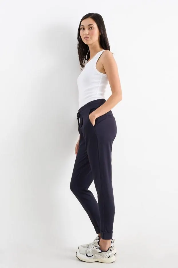Jersey trousers - mid-rise waist - tapered fit