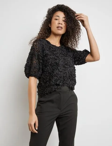 Kanten shirt met bloemenversiering