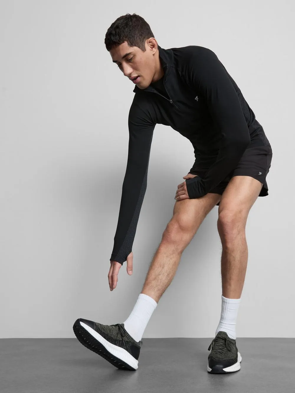 Camiseta deportiva con cremallera de 1/4