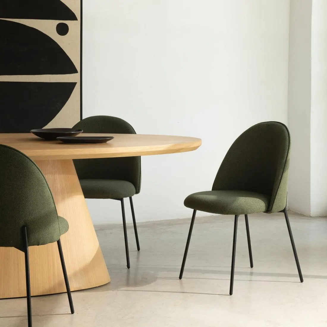 Silla tapizada verde oscuro