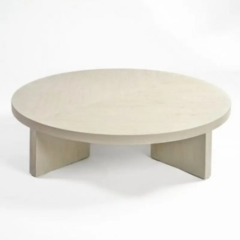 Round grayish white wooden coffee table