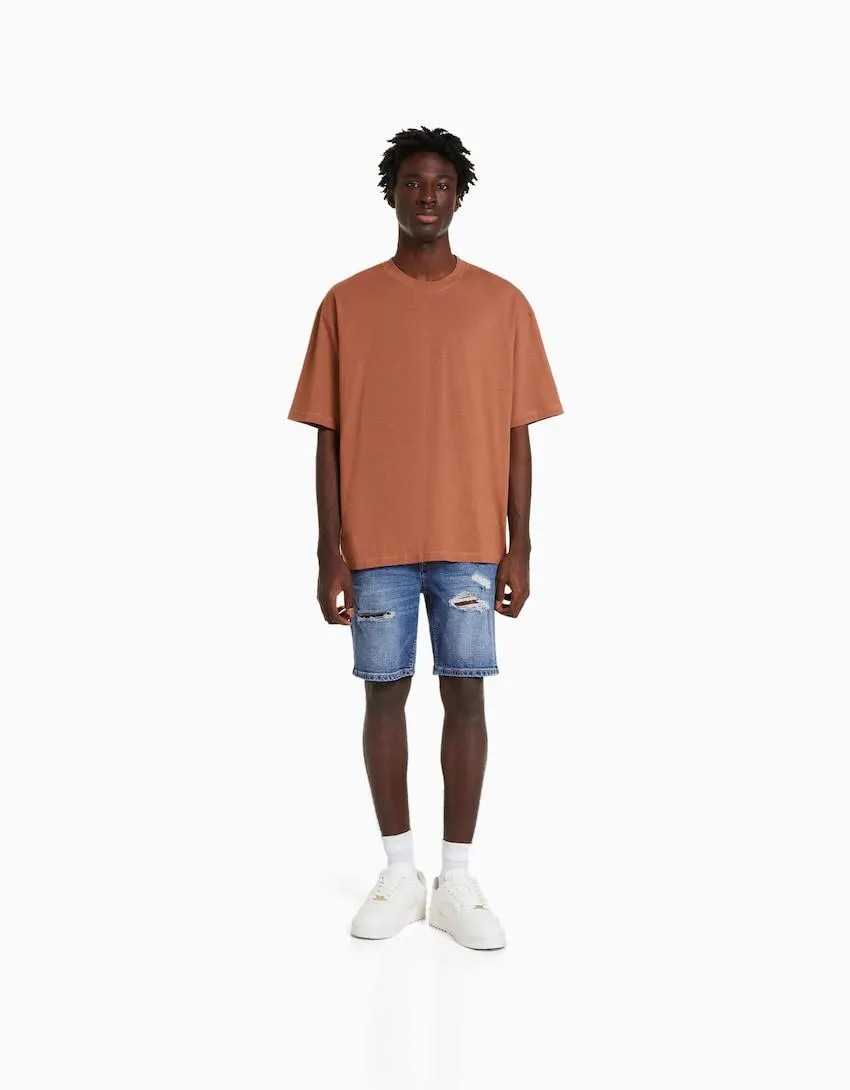 Ripped denim Bermuda shorts