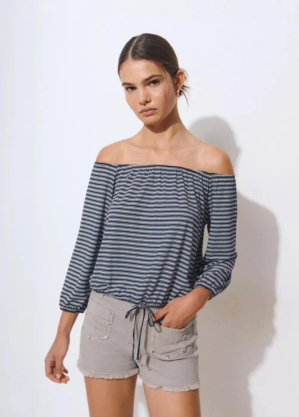 Camiseta escote bardot raya tejida