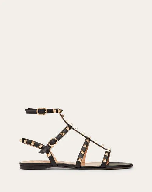 SANDALIAS PLANAS ROCKSTUD DE PIEL DE BECERRO CON TIRAS