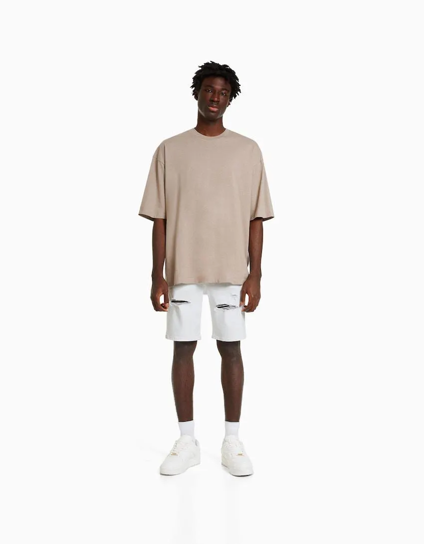 Ripped denim Bermuda shorts