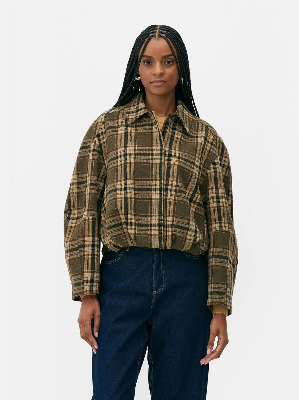 Chaqueta a cuadros con bajo abullonado