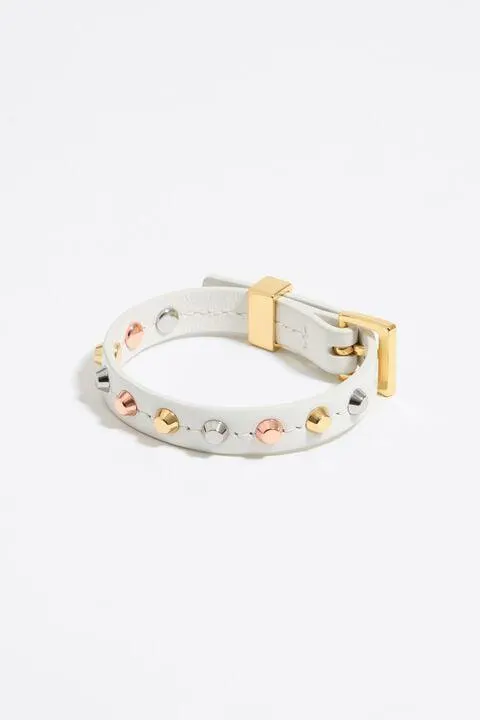 Pulsera piel tachas marfil