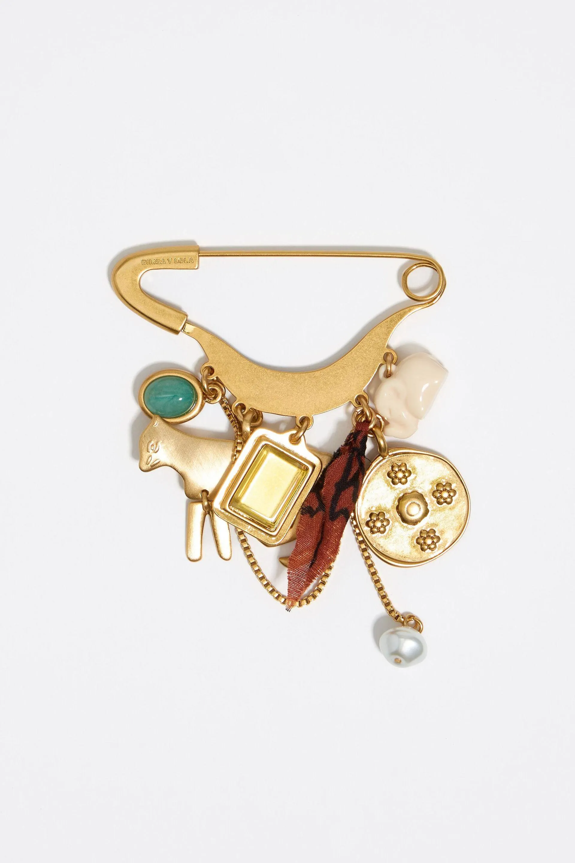 Broche imperdible motivos metal dorado