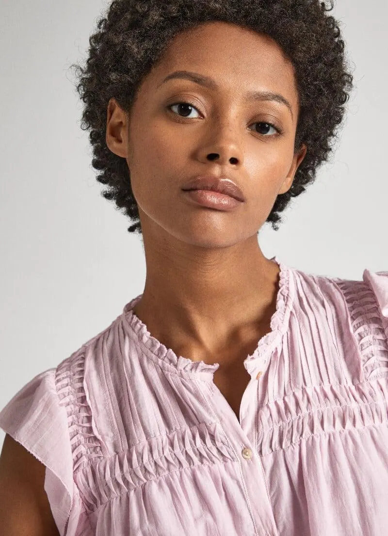 BLUSA CON DETALLES PLISADOS