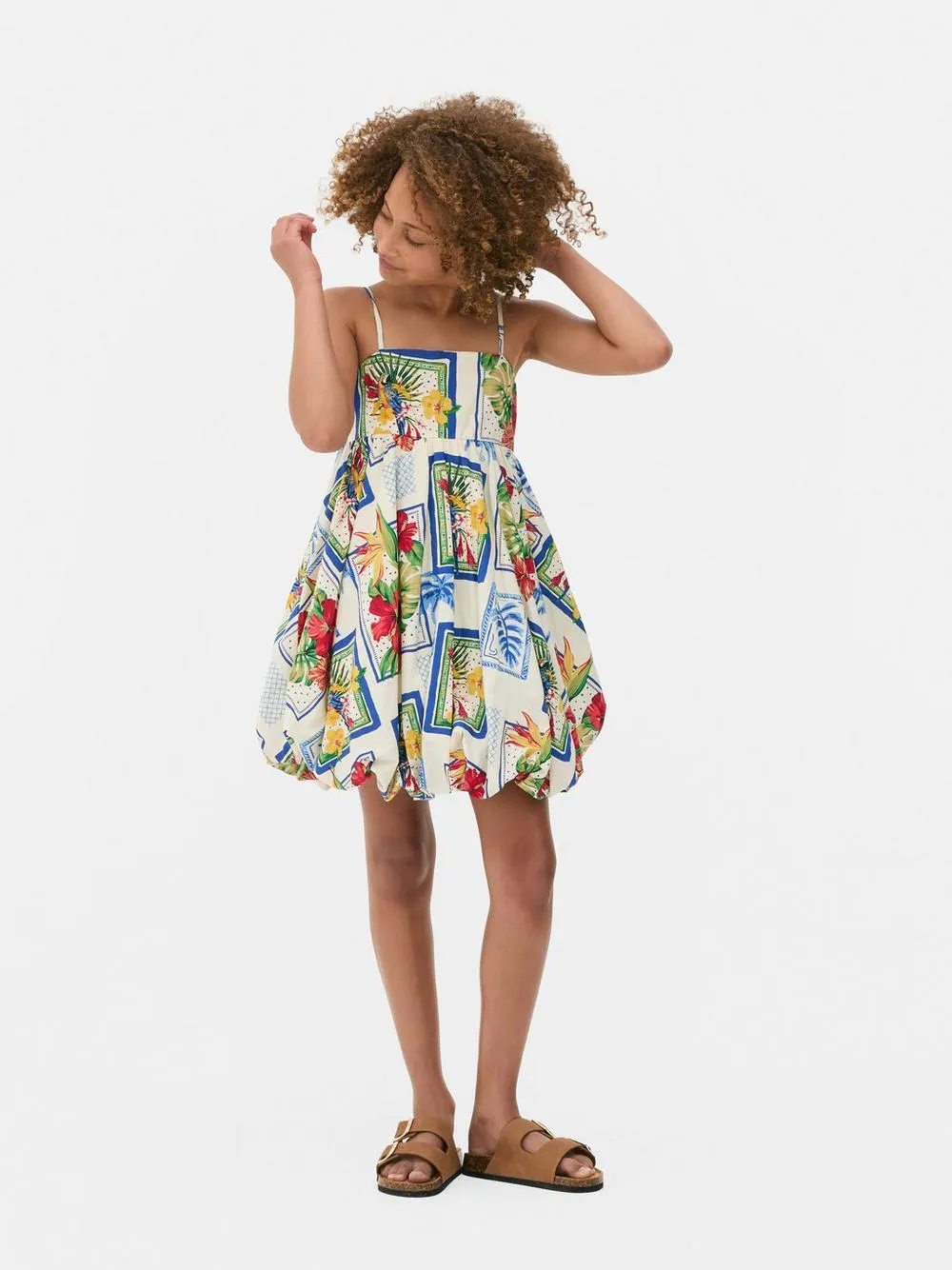 7-15 años | Vestido tropical con bajo abullonado