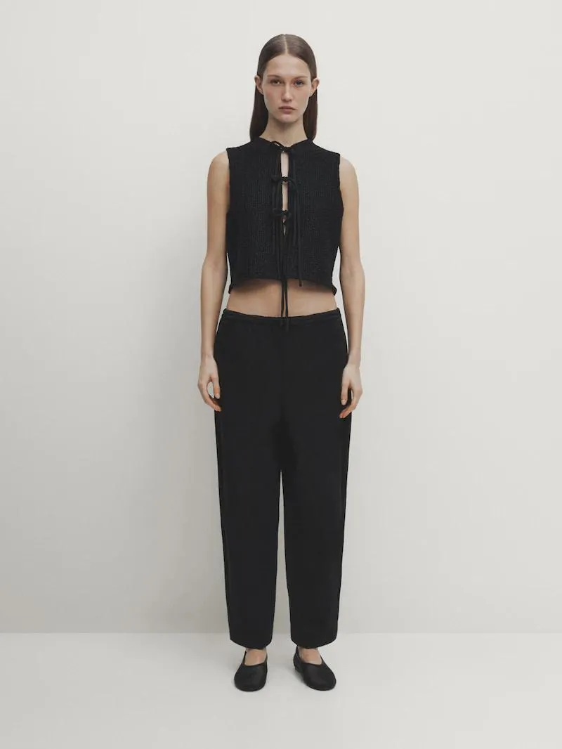 Chaleco punto cuello redondo detalle lazos