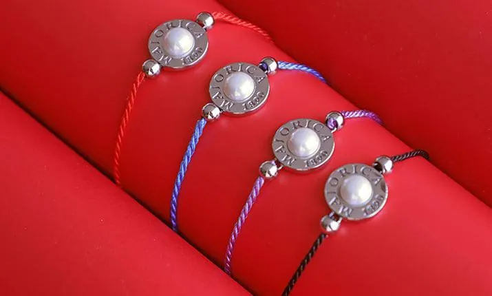 Pulsera Lipari trenzada negra con perla media bola