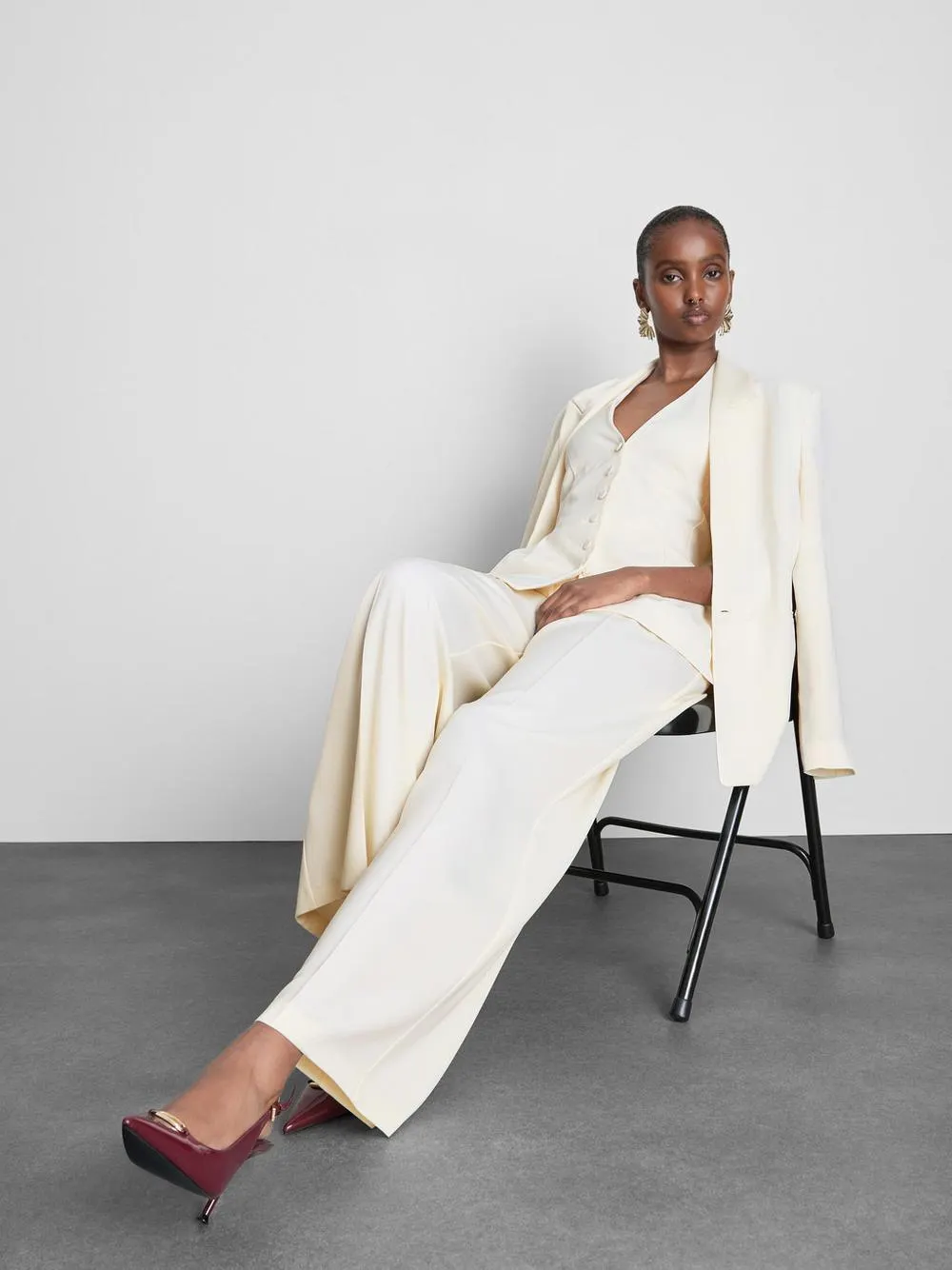 Pantalones de satén plisados de pernera ancha