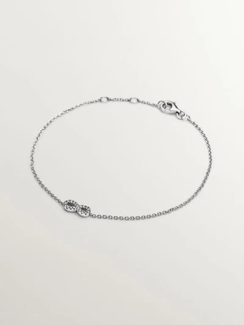 Pulsera de oro blanco de 18K con infinito y diamantes