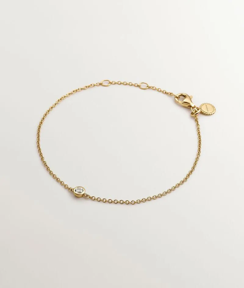 Pulsera solitario de plata 925 bañada en oro amarillo de 18K con topacio blanco