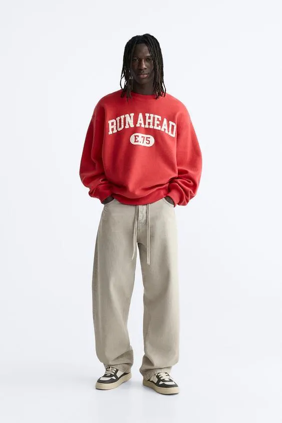 SWEATSHIRT WITH PRINTED SLOGAN