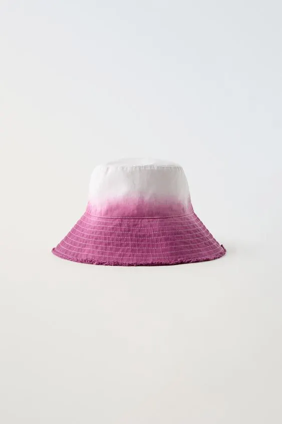 FRAYED TIE-DYE BUCKET HAT
