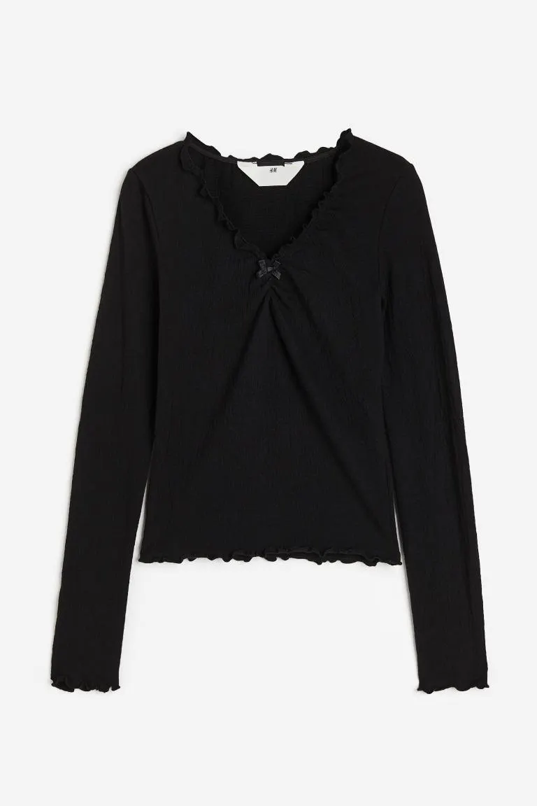 Rypytetty trikoopusero