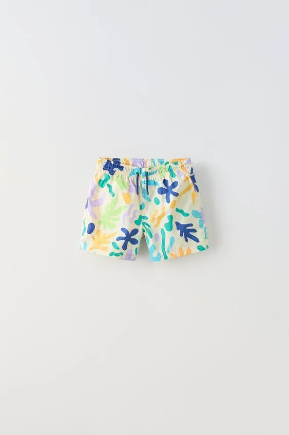 6-14 YEARS/ SWIM SHORTS WITH SUN AND LEAF PRINT