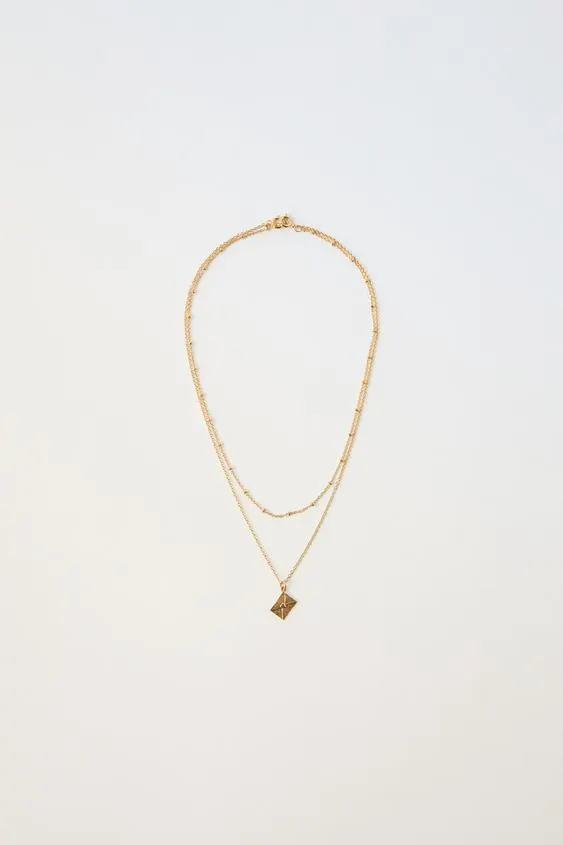 PACK OF TWO BEAD AND CHARM NECKLACES PLATED IN 24K GOLD