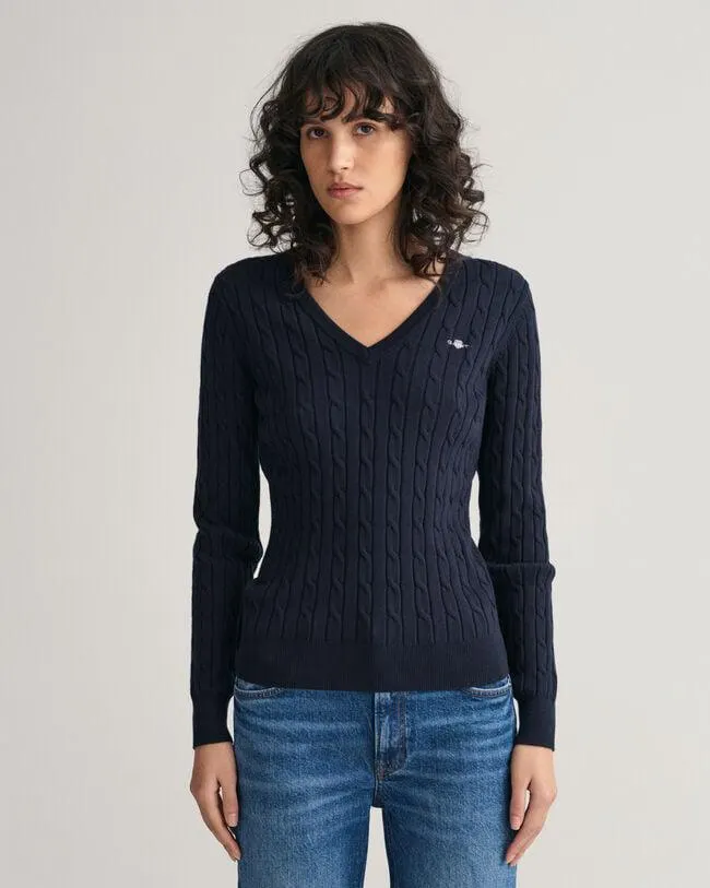 Joustava puuvillapalmikkoneule, jossa v‑pääntie