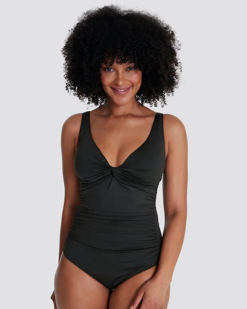 Uimapuku, edessä solmukoristeet